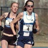 ...under her college coach, Ray Treacy, held off McGregor to take third in 26:02.