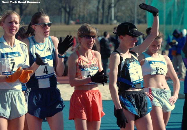 Kastor's competitors applaud as she is introduced.