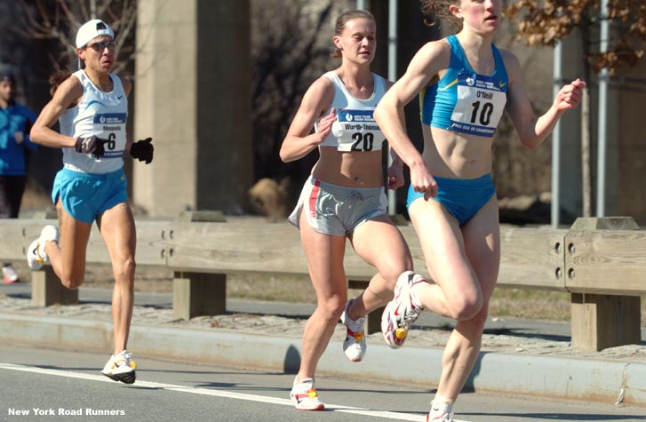 Christin Wurth-Thomas (a 2003 Arkansas graduate) and Sylvia Mosqueda trail O'Neill.