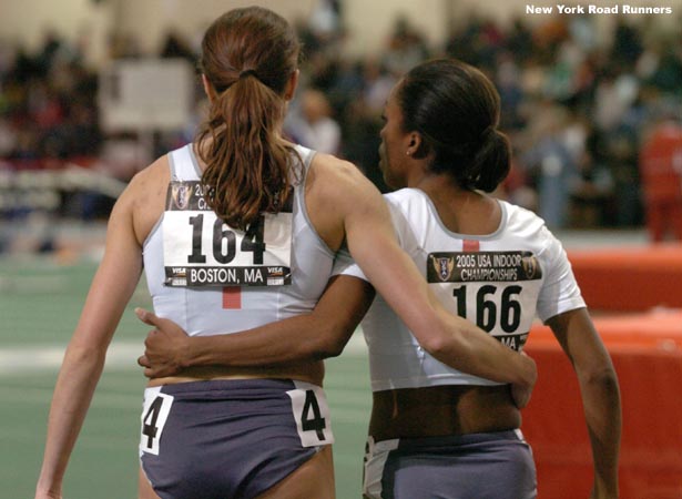 Mary Jayne Harrelson and Treniere Clement head off the track arm in arm.