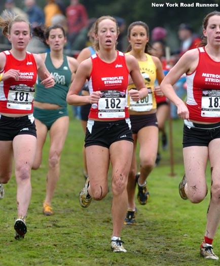 #182 Morgan Kuykendall of Metroplex Striders runs with two of her teammates.