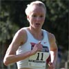 Just past the mile mark, Shalane Flanagan continues to run alone out front.