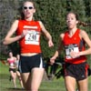 Dawn Cleary (left, pictured with Lucinda Hull) finished 16th in 14:11.3.