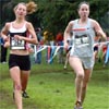 Linn Schulte-Sasse (left) of See Jane Run runs with Jeanne Hennessy.