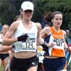 Colleen Stroud of Denver, Colorado, leads an unidentified runner.