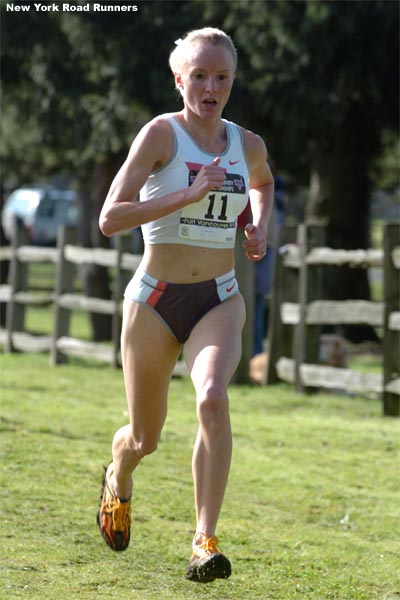 Just past the mile mark, Shalane Flanagan continues to run alone out front.