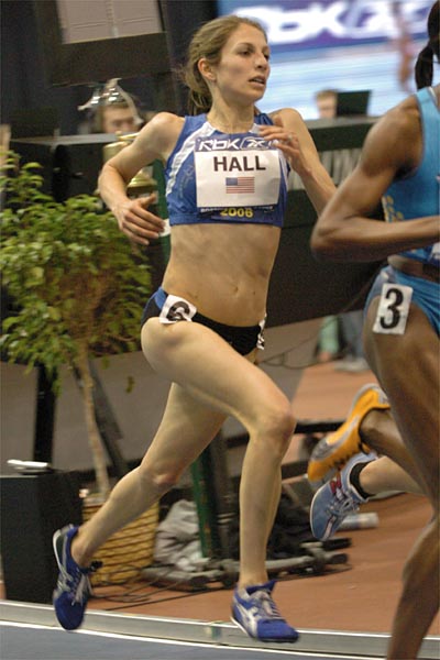 Sara Hall runs at the back of the pack.