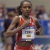 Tirunesh Dibaba pulls away from her older sister.