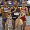 On the first lap, Nikeya Green leads Frances Santin (left) and Schnell.