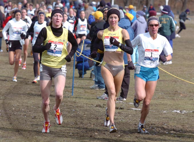 Approaching the 2K mark, (L-R) Katie McGregor, Blake Russell, and Colleen De Reuck run together up front.