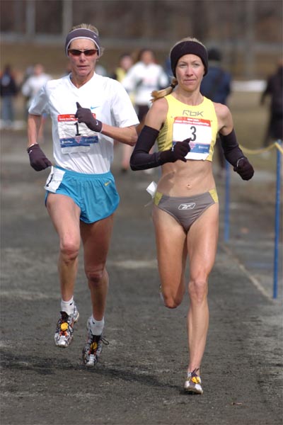 Approaching the 6K mark, Colleen De Reuck (lef) and Blake Russell continue to run together.