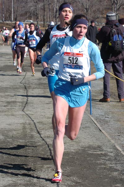 Nicole Aish leads Kara Goucher. Both Aish and Goucher are married to professional runners. Kara's husband Adam won the men's 4K the previous day.