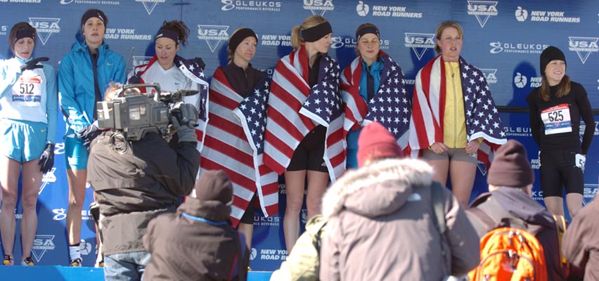 L-R: Nicole Aish, Kara Goucher, Sarah Schwald, Blake Russell, Carrie Tollefson, Lauren Fleshman, Amy Mortimer, and Rebecca Donaghue.